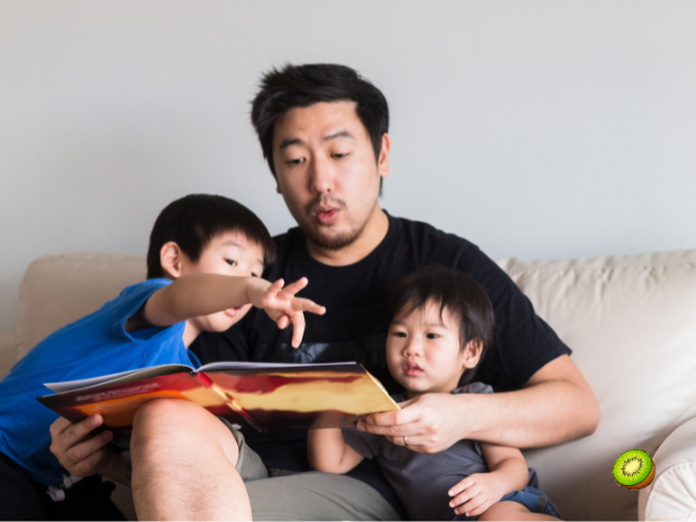 homeschooling father reading to his child